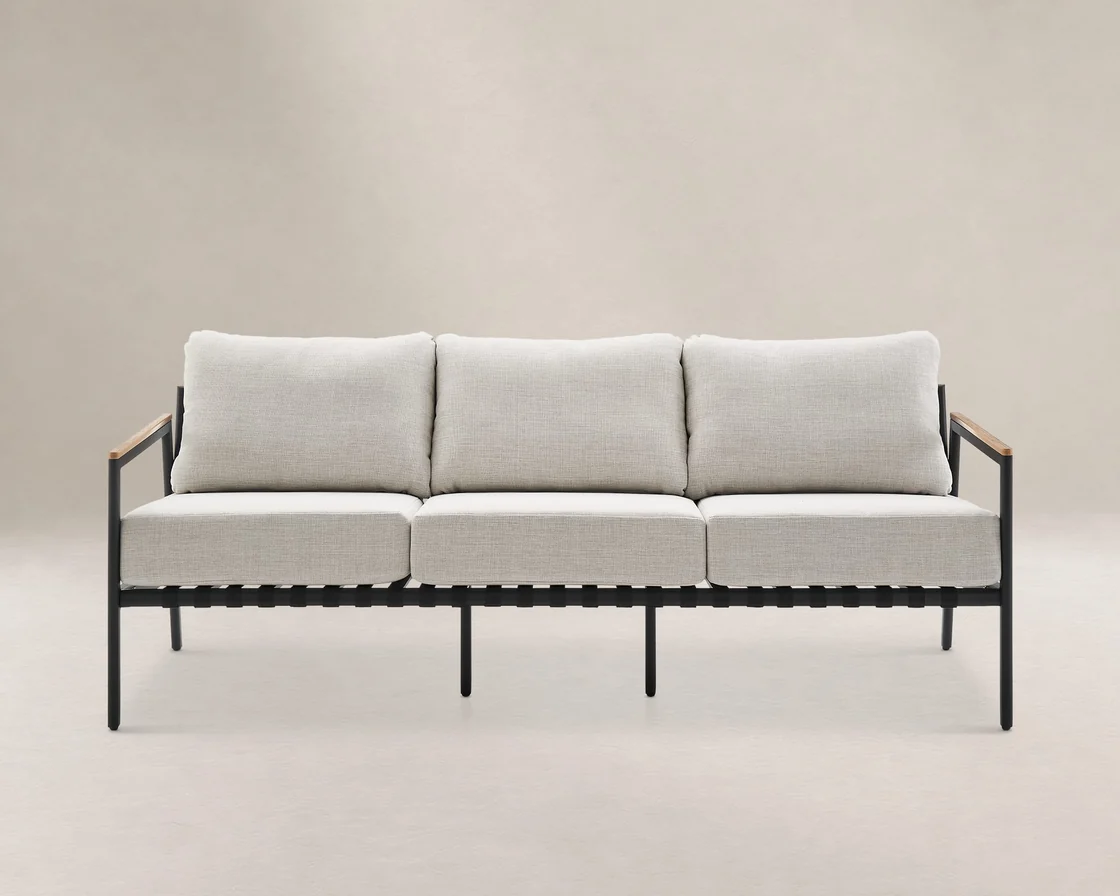 Castlery Sorrento outdoor three-seater sofa with aluminium frame, timber-look armrests and loose cushions