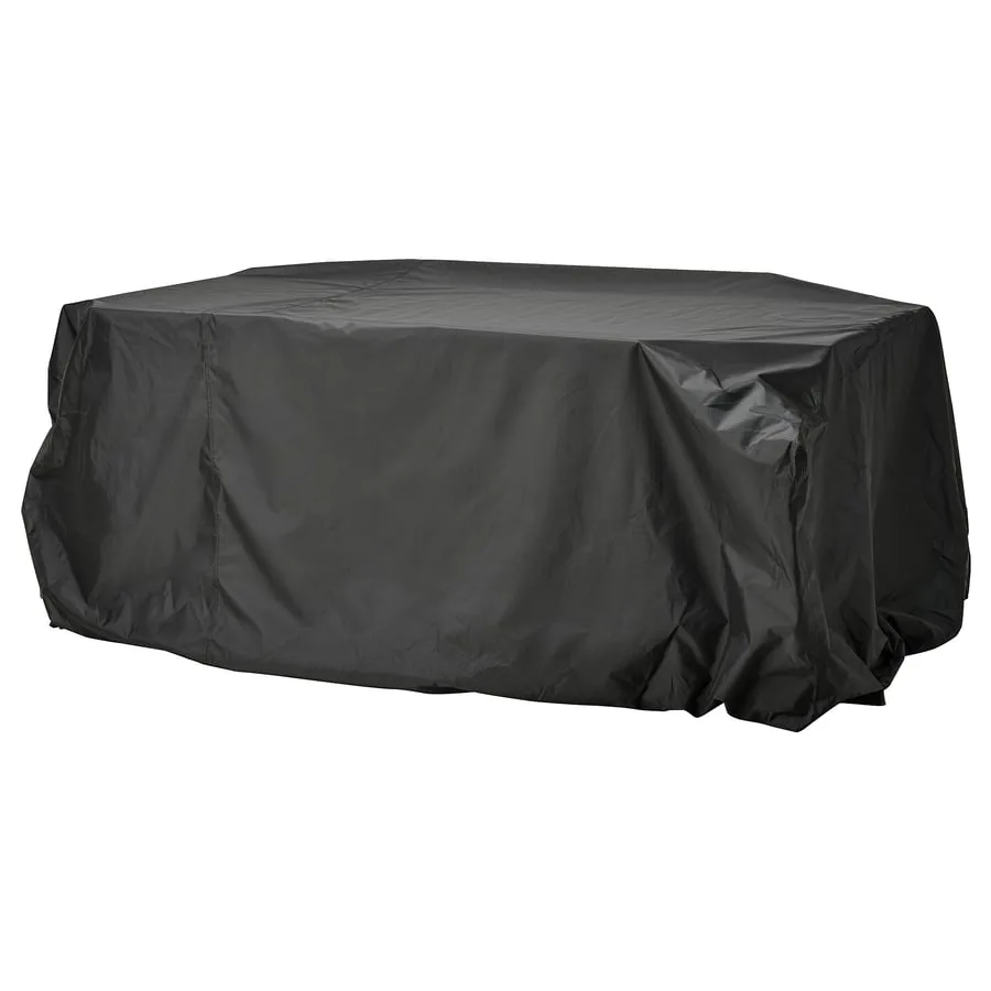 Black IKEA TOSTERÖ cover fitted over a low furniture group on a white background.